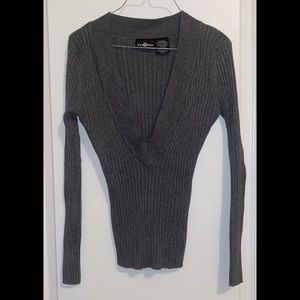 Deep v neck stretch sweater. Gently used.
